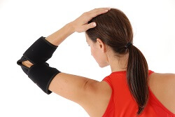 A Back View of a King Brand Elbow Wrap in Use
