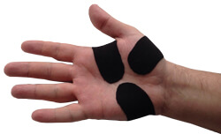 A hand that has been taped with KB Support Tape to prevent re-injury