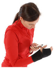 A photo of a woman wearing the King Brand® BFST® Wrist Wrap and using the included controller